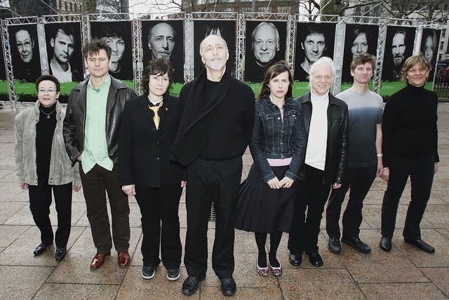 Former Beach Boy David Marks, who suffered from hepatitis C, and photographer Michelle Martinoli pose with others who feature in the exhibition of people who have lived with the illness, March 2005