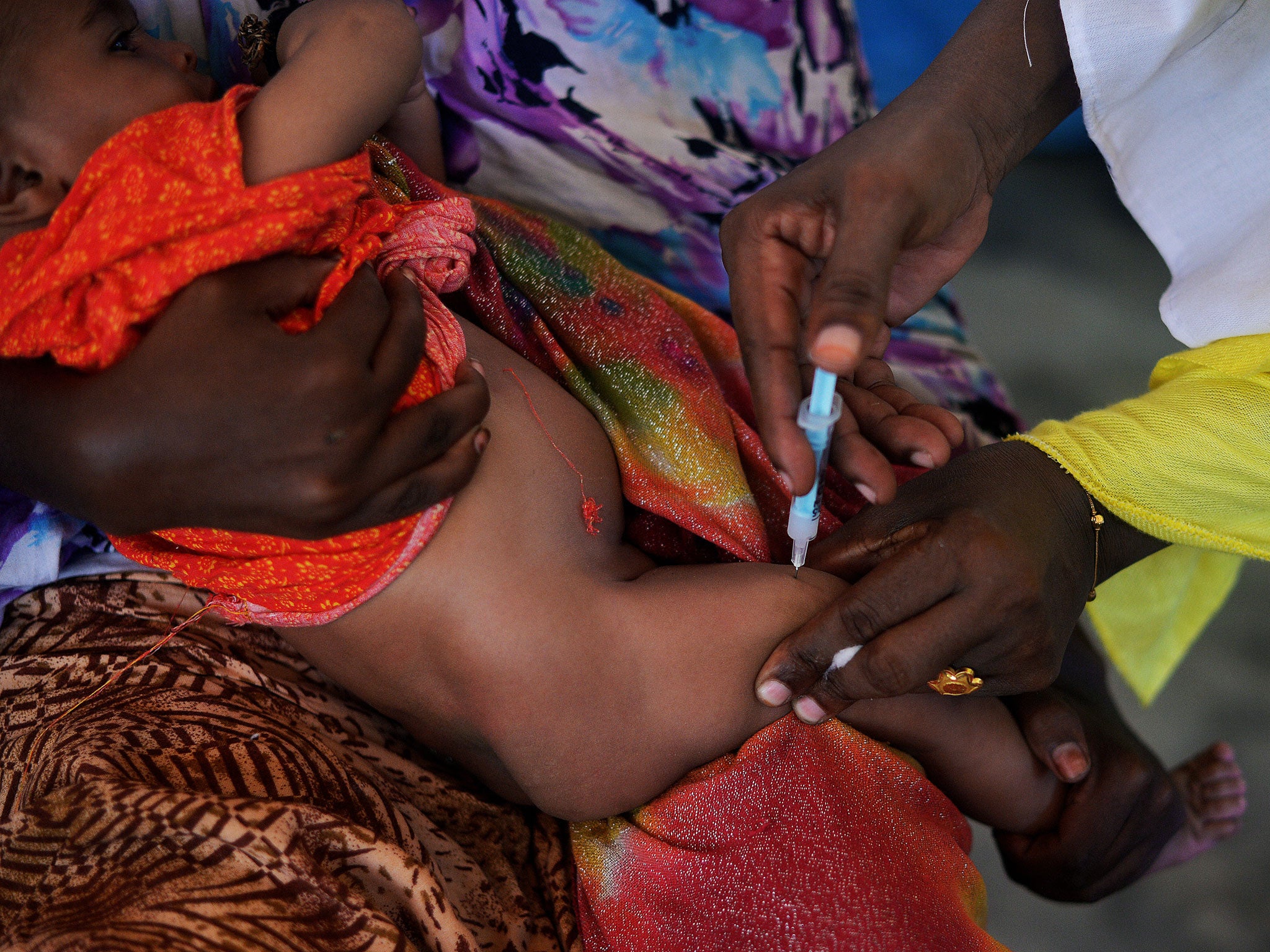 A Somali baby is given a pentavalent vaccine injection at a medical clinic in Mogadishu. The vaccine, which includes protection against meningitis, diphtheria, tetanus, whooping cough and hepatitis B, is being given to all children under a year old in Somalia
