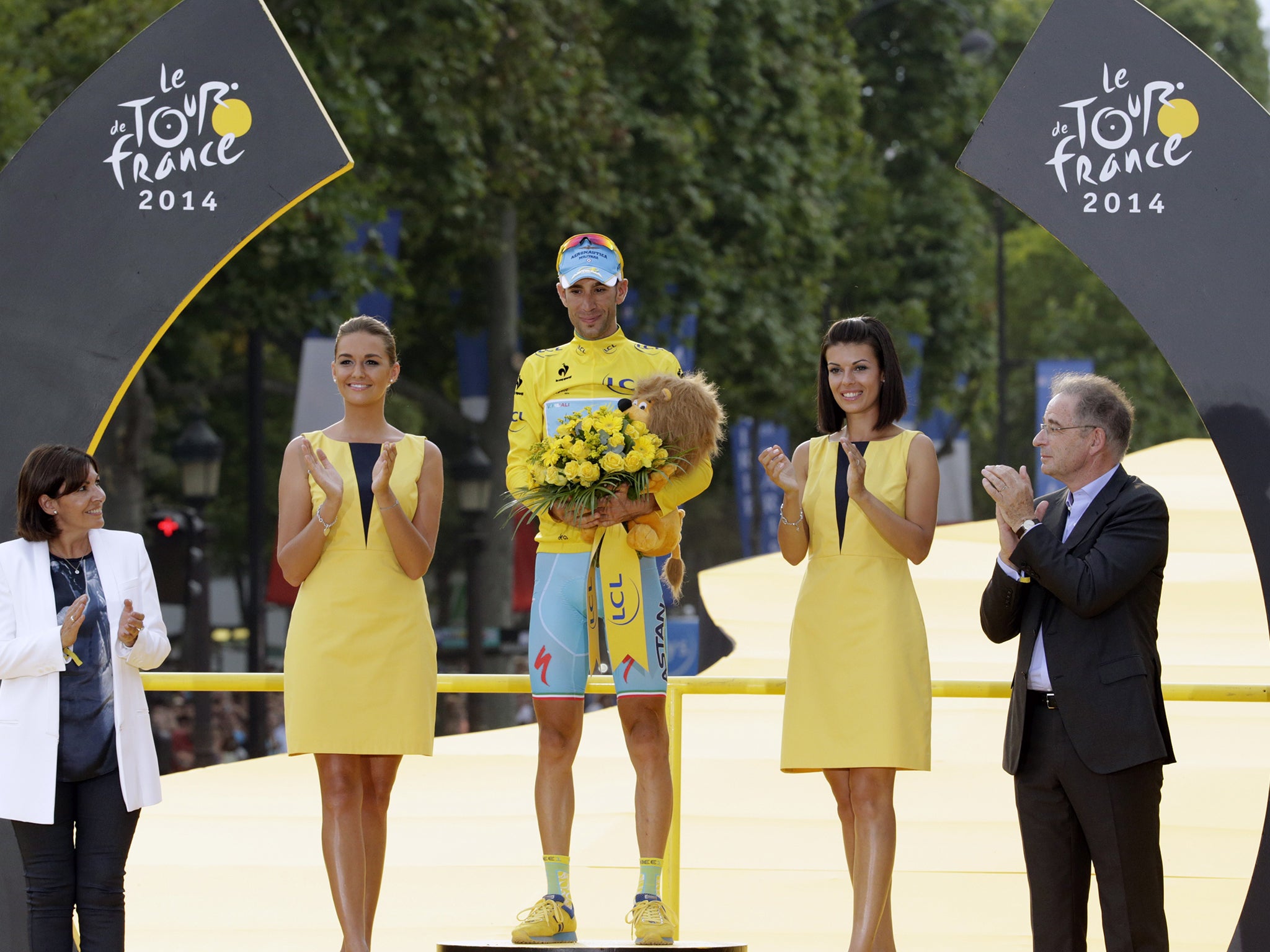 Vincenzo Nibali poses on the podium after winning the Tour de France