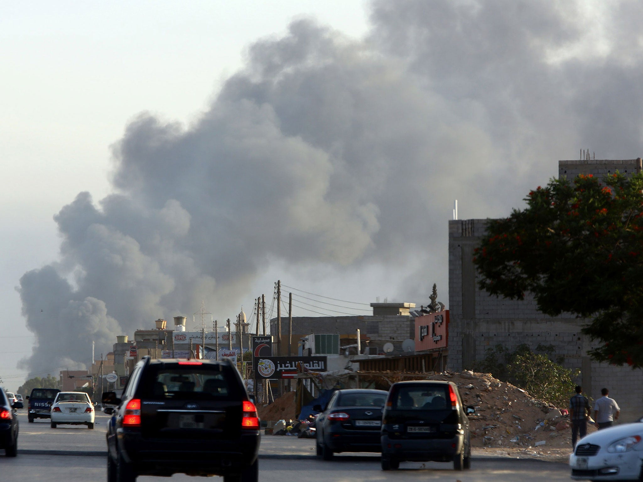 Smoke billows from an area near Tripoli's international airport during fighting between rival factions around the capital's airport