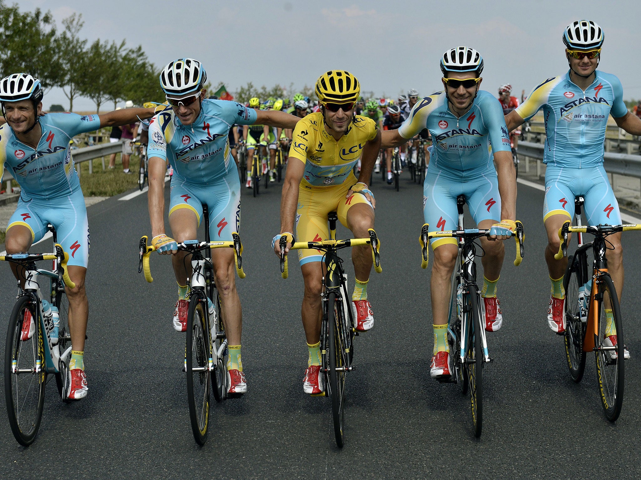 Vincenzo Nibali poses with his Astana team-mates on the final stage of the Tour de France