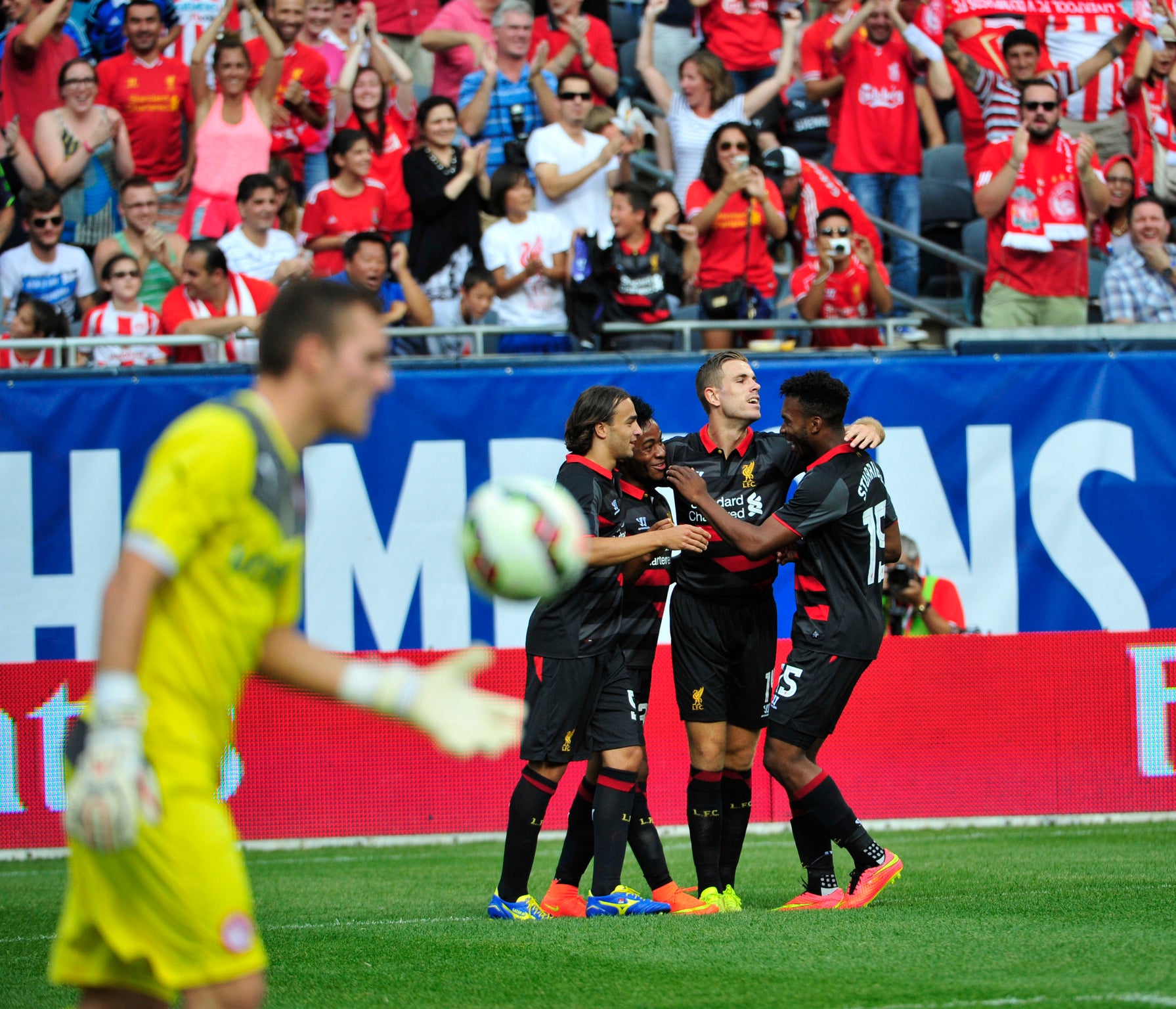 Raheem Sterling celebrates scoring in the fifth minute