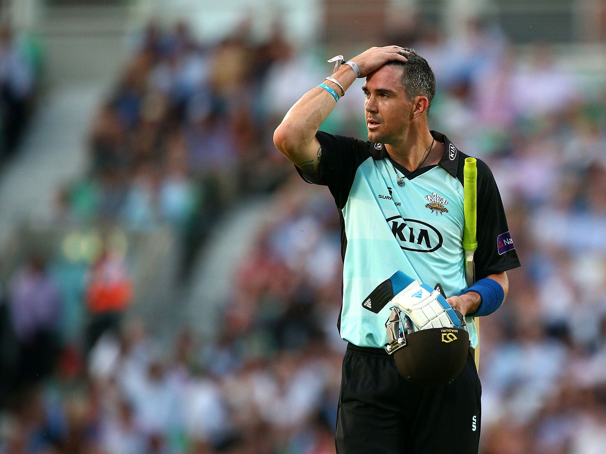 Kevin Pietersen walks off the pitch for Surrey after being dismissed
