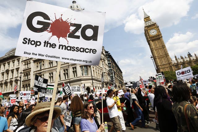 Demonstrators march through the streets from outside the Israeli embassy in central London on July 26, 2014, calling for an end to violence in Gaza. 