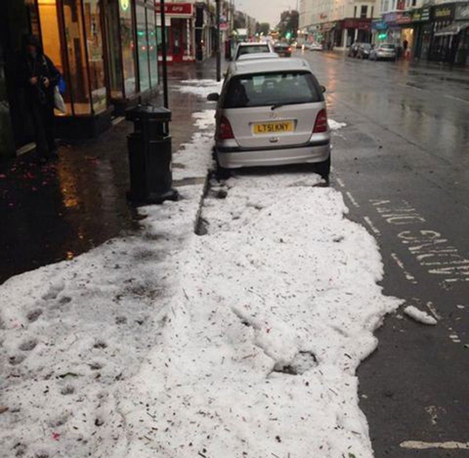 Photo taken from the twitter feed of @MPS UxbSouth with permission of the aftermath of a hailstorm in Church Road, Hove