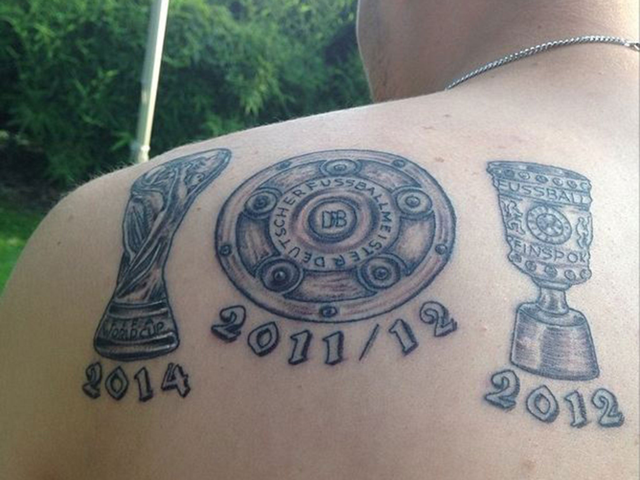 Kevin Grosskreutz shows off his World Cup tattoo even though he didn't play a minute in Brazil