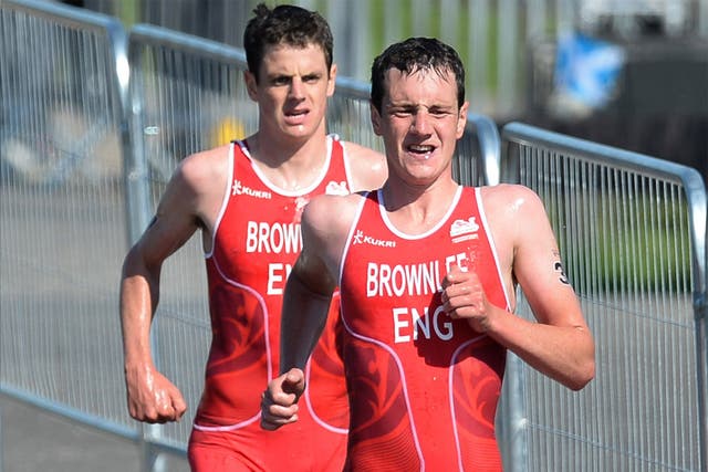 Alistair and Jonathan Brownlee on their way to winning medals in the mens triathlon 