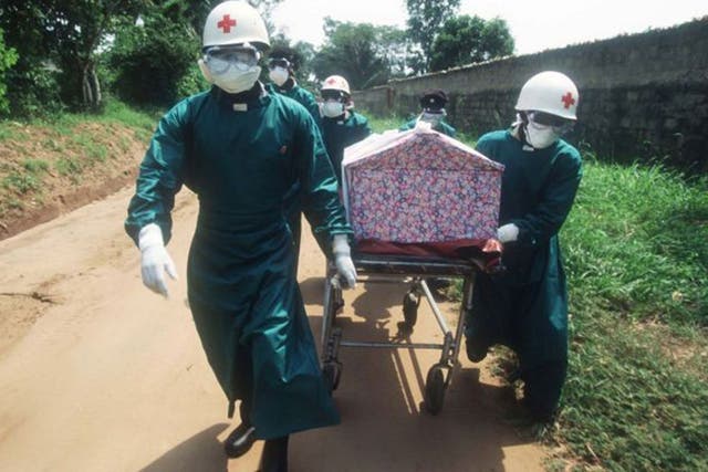 Body of evidence: health workers transport a casket of a nun whose death resulted from an Ebola infection in Zaire in 1995 
