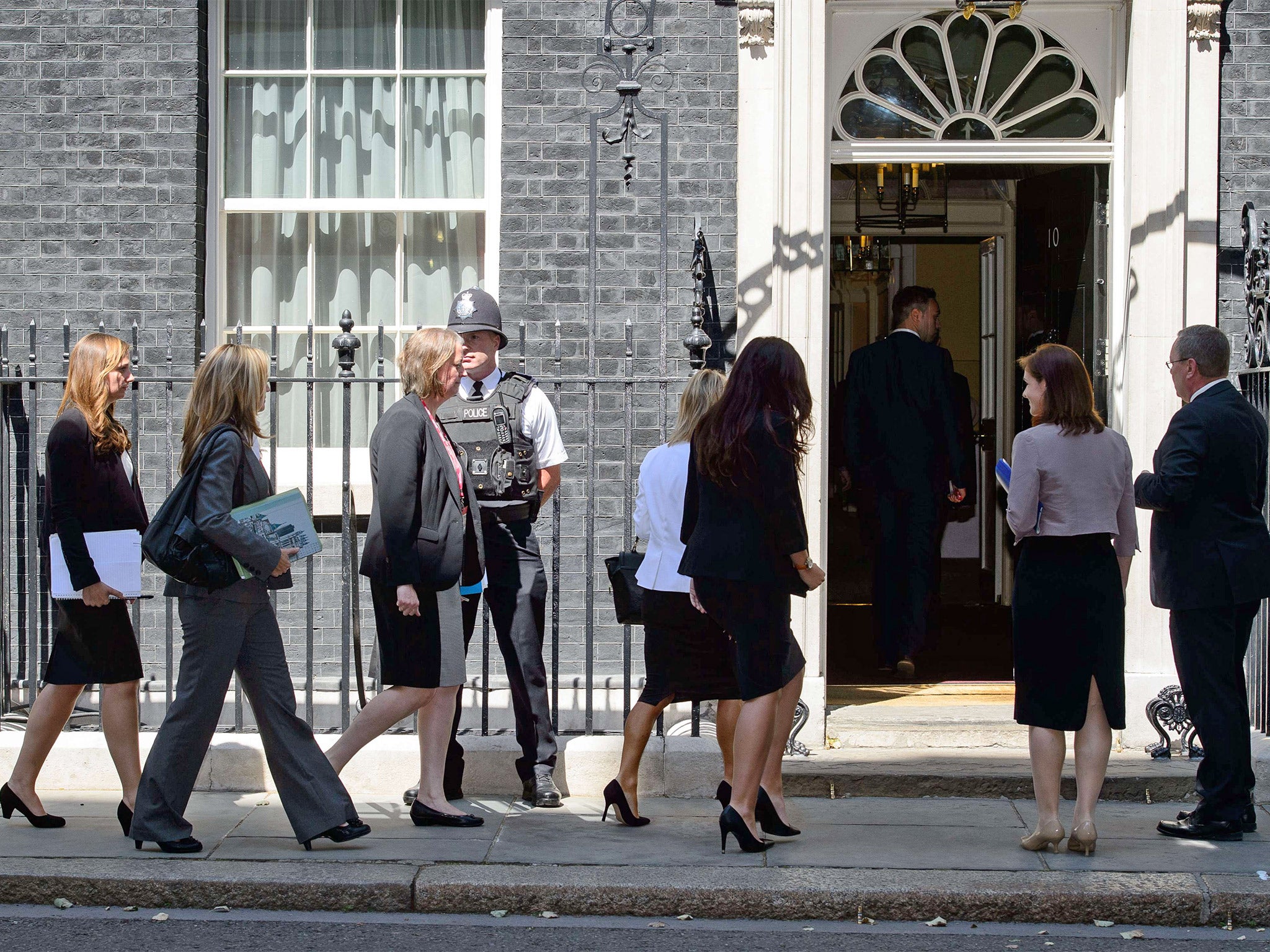 Relatives of the British victims of MH17 arrive at 10 Downing Street for a meeting with David Cameron (Getty)