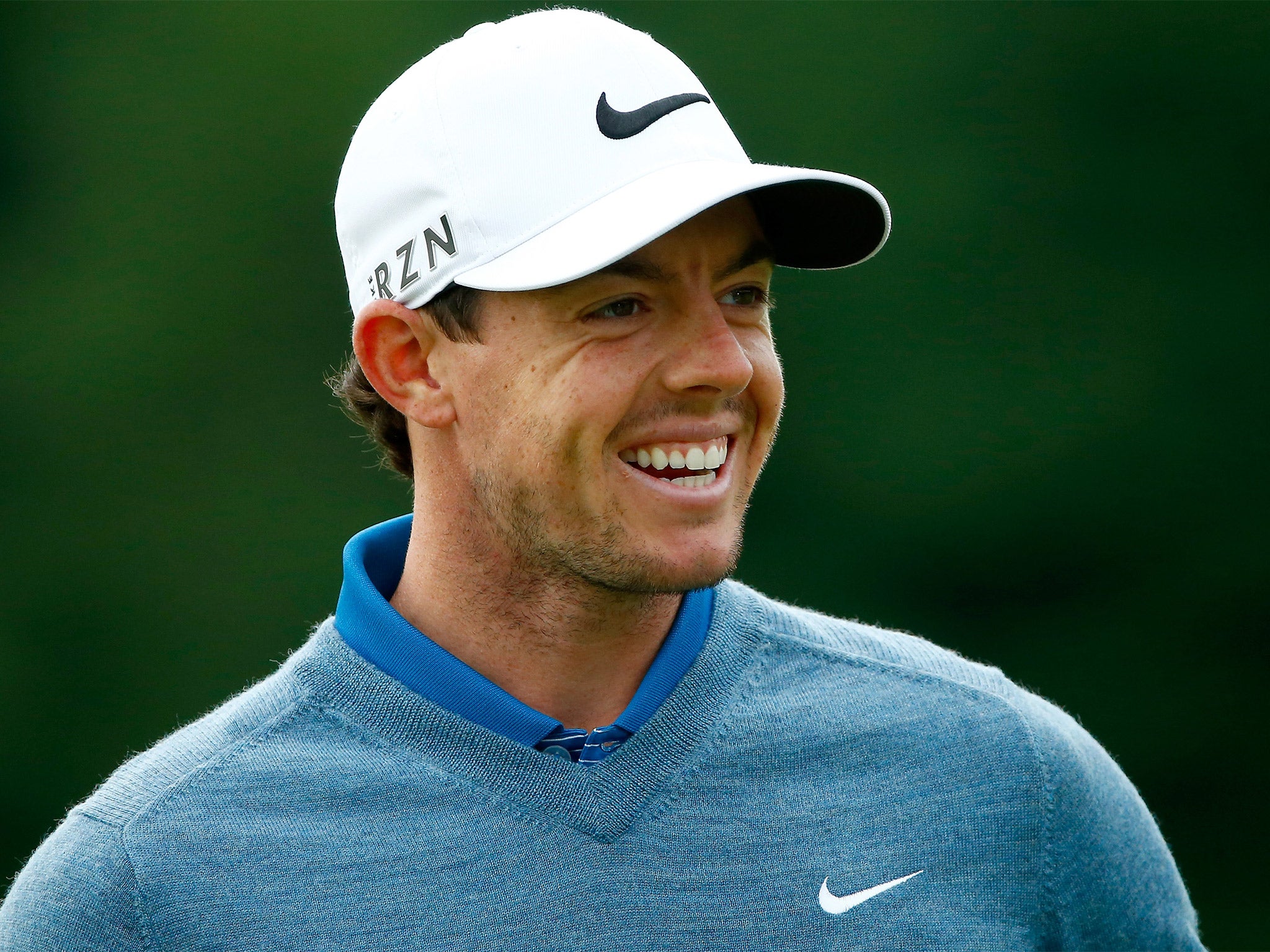 Rory McIlroy smiles during a practice round for the World Golf Championships-Bridgestone Invitational in Akron, Ohio