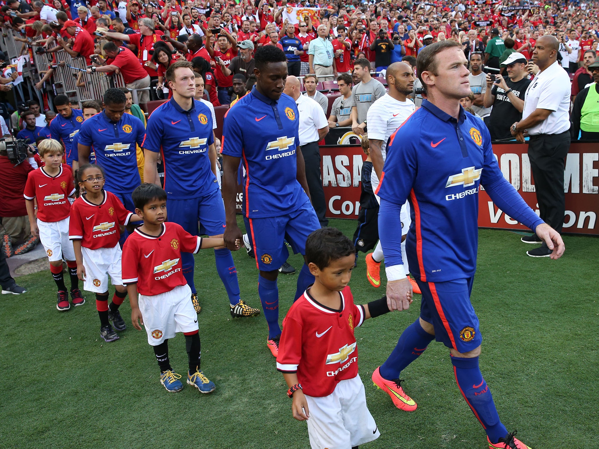 The Manchester United team walk out ahead of the pre-season friendly between Manchester United and Inter Milan at FedExField