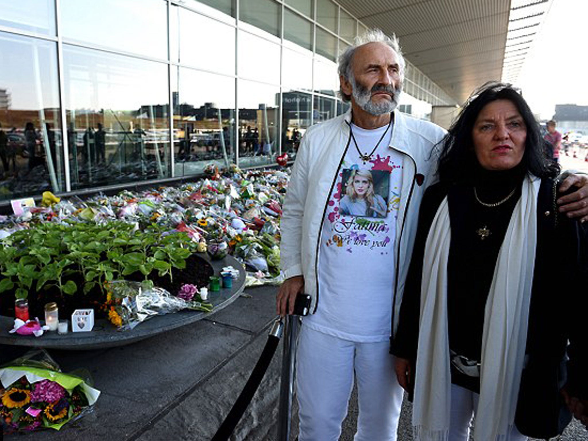 George and Angela Dyczynski the parents of 25-year-old only child Fatima Dyczynski stand outside the airport