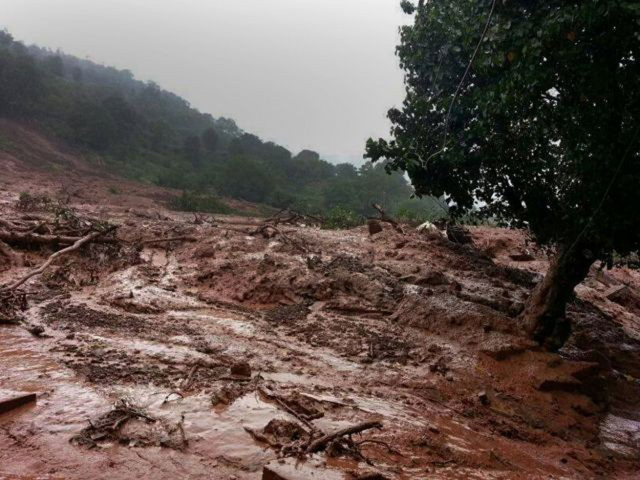 A mudslide is seen in Malin village in Pune district the western Indian state of Maharashtra on July 30, 2014.