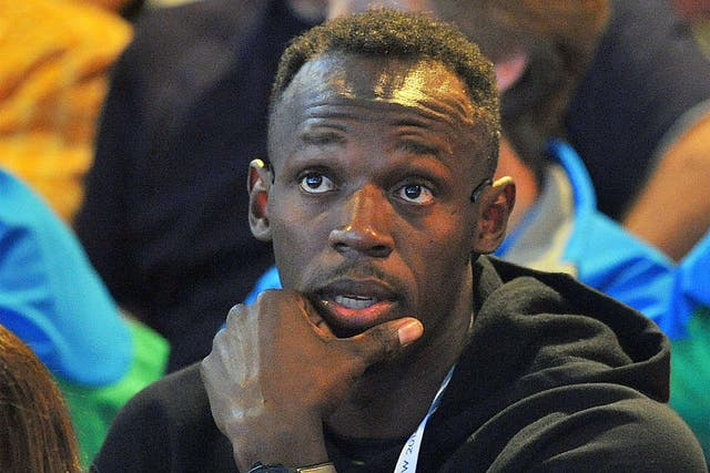 Usain Bolt, pictured watching a women's netball match between Jamaica and New Zealand