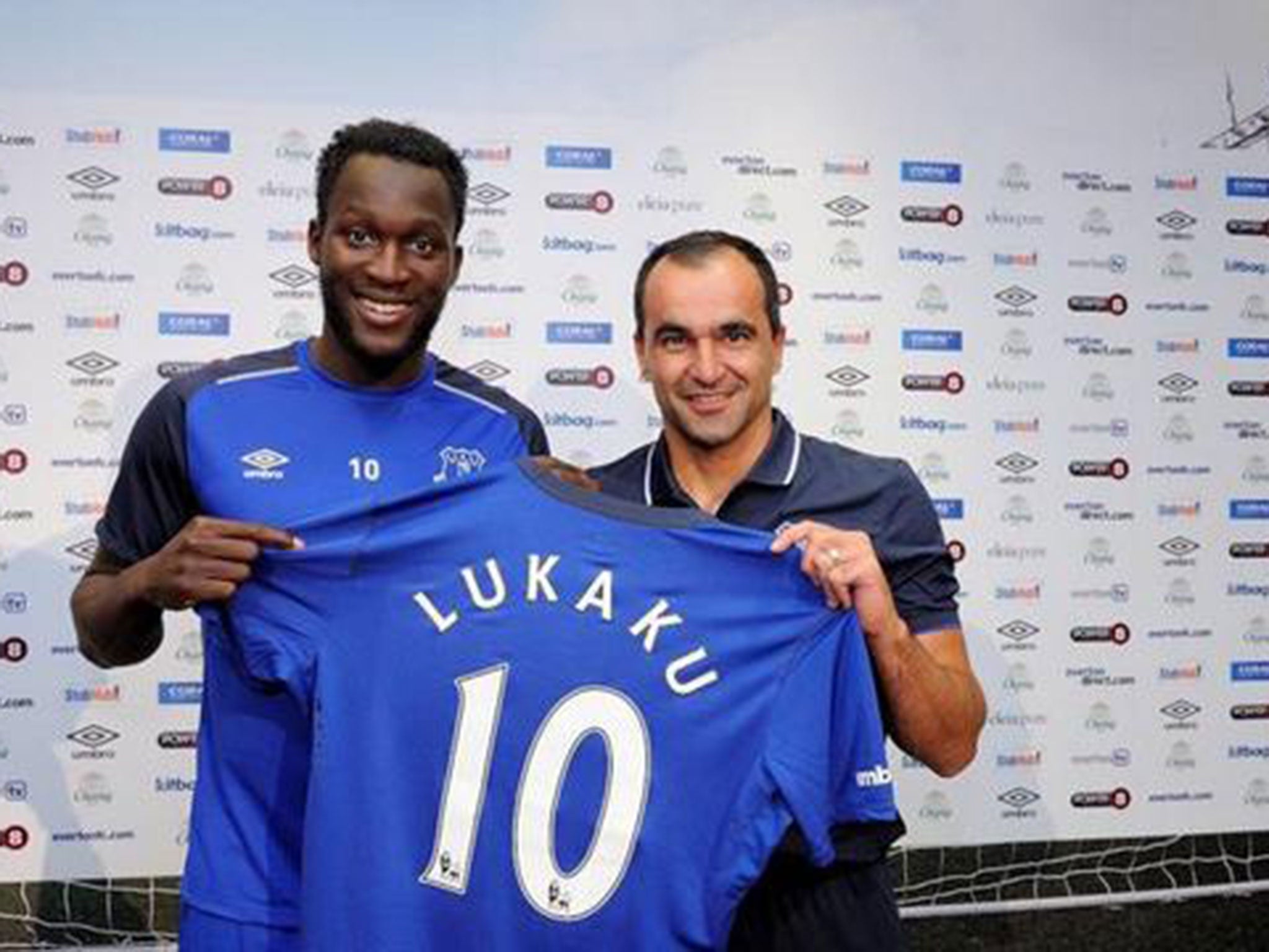 Romelu Lukaku (left) is presented by manager Roberto Martinez after joining Everton for a club-record £28m