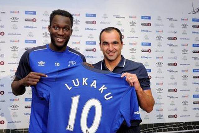 Romelu Lukaku (left) is presented by manager Roberto Martinez after joining Everton for a club-record £28m
