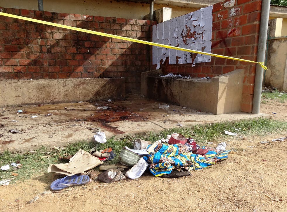 Clothes and footwear belonging to victims lie on the ground at the site of the Kano State Polytechnic institute where a suicide bombing was carried out on Wednesday