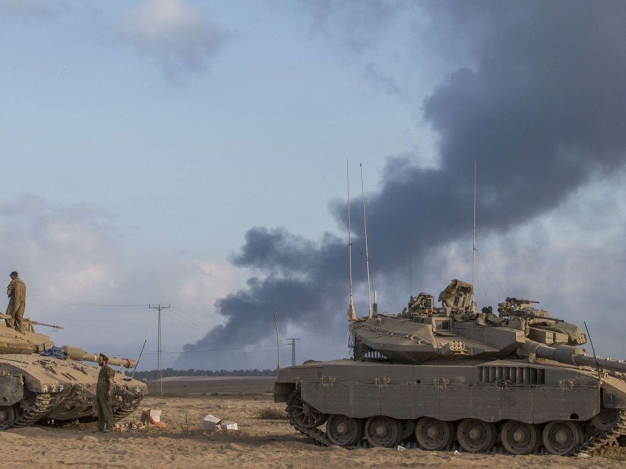 Israeli Merkava tanks are seen at an army deployment area near the border with the Gaza Strip, on July 31, 2014