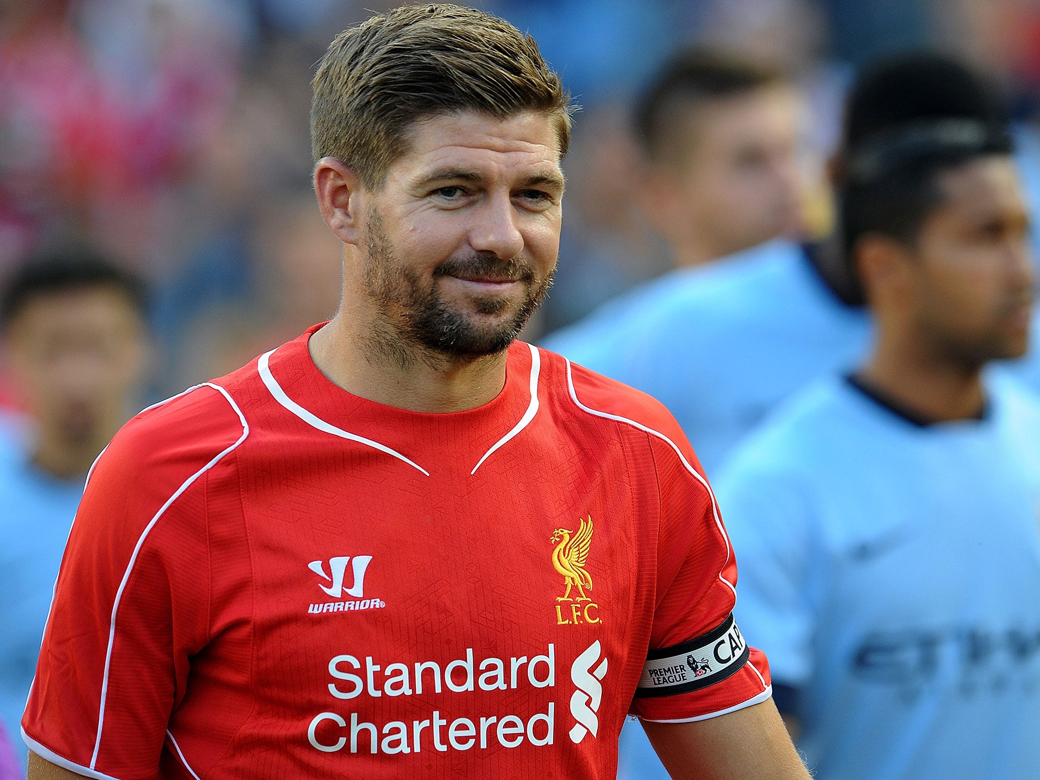 Steven Gerrard smiles during the 2-2 draw with Manchester City
