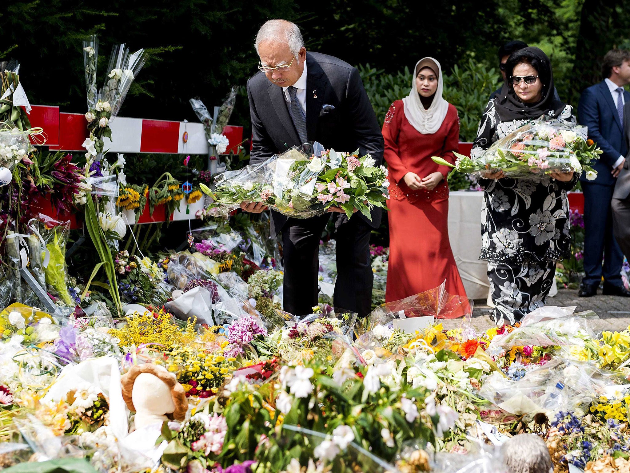 Malaysian Prime Minister Najib Razak, left, and his wife Rosmah Mansor in Hilversum, Netherlands, where crash victims were identified