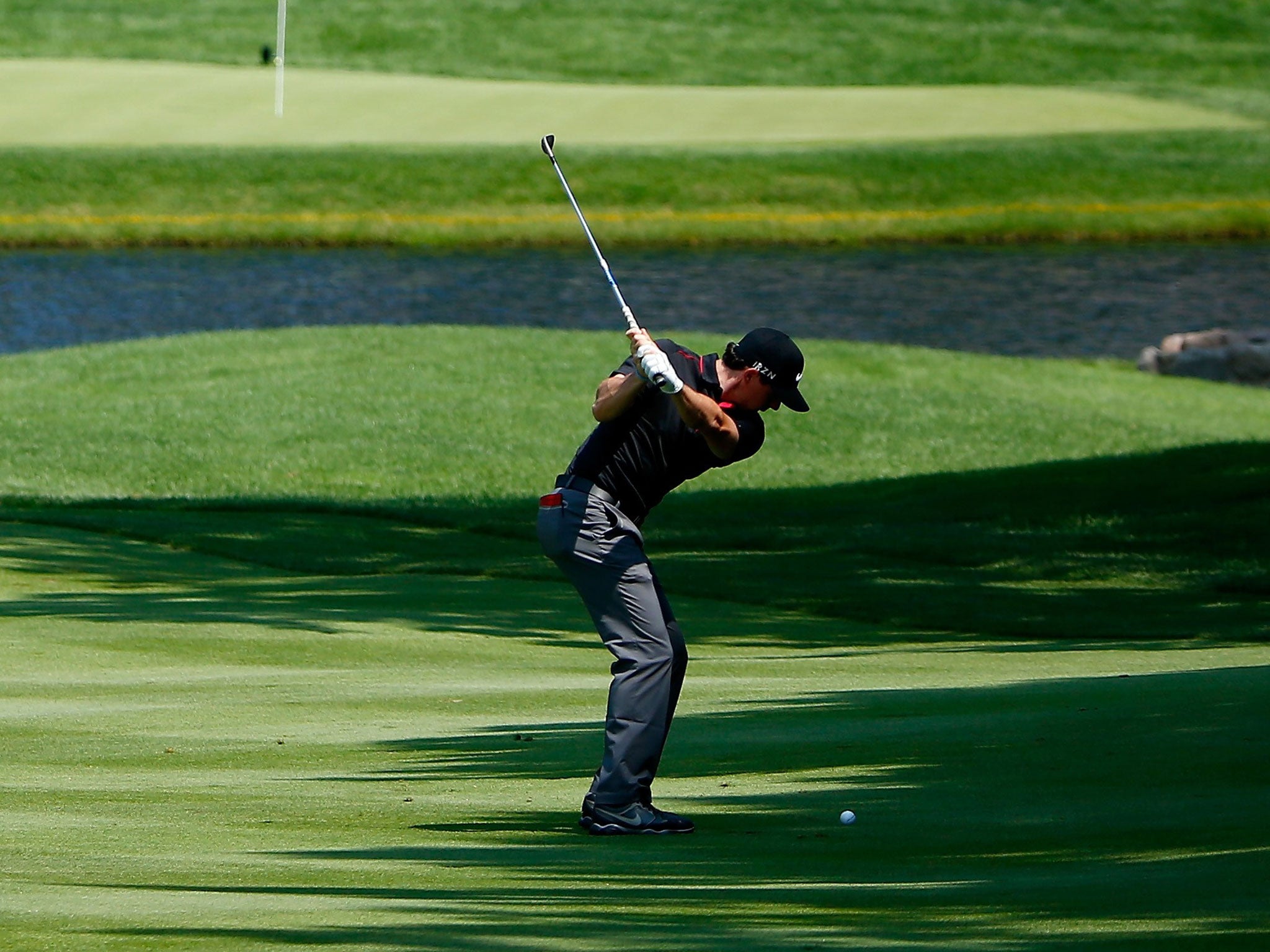 Rory McIlroy hits from the 16th fairway on the way to his
first round score of 69 yesterday