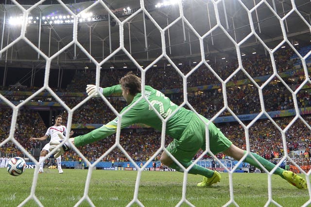 Netherlands' goalkeeper Tim Krul fails to make a save from Costa Rica's midfielder Celso Borges during a penalty shoot-out in the quarter-final between Netherlands and Costa Rica during the 2014 FIFA World Cup 