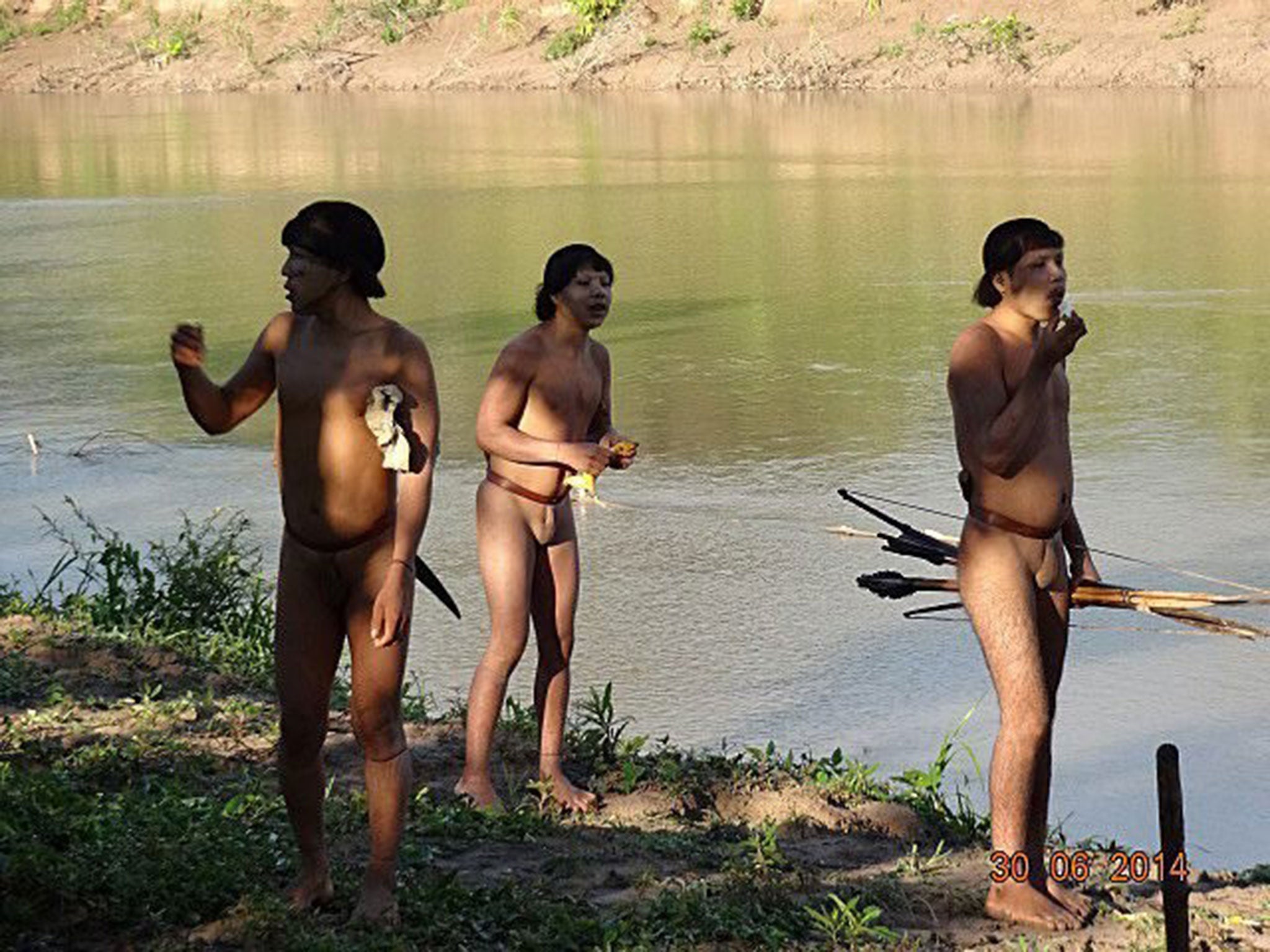 Indigenous people from a previously uncontacted tribe are filmed at Alto Envira, Acre State, by Brazil’s National
Indian Foundation