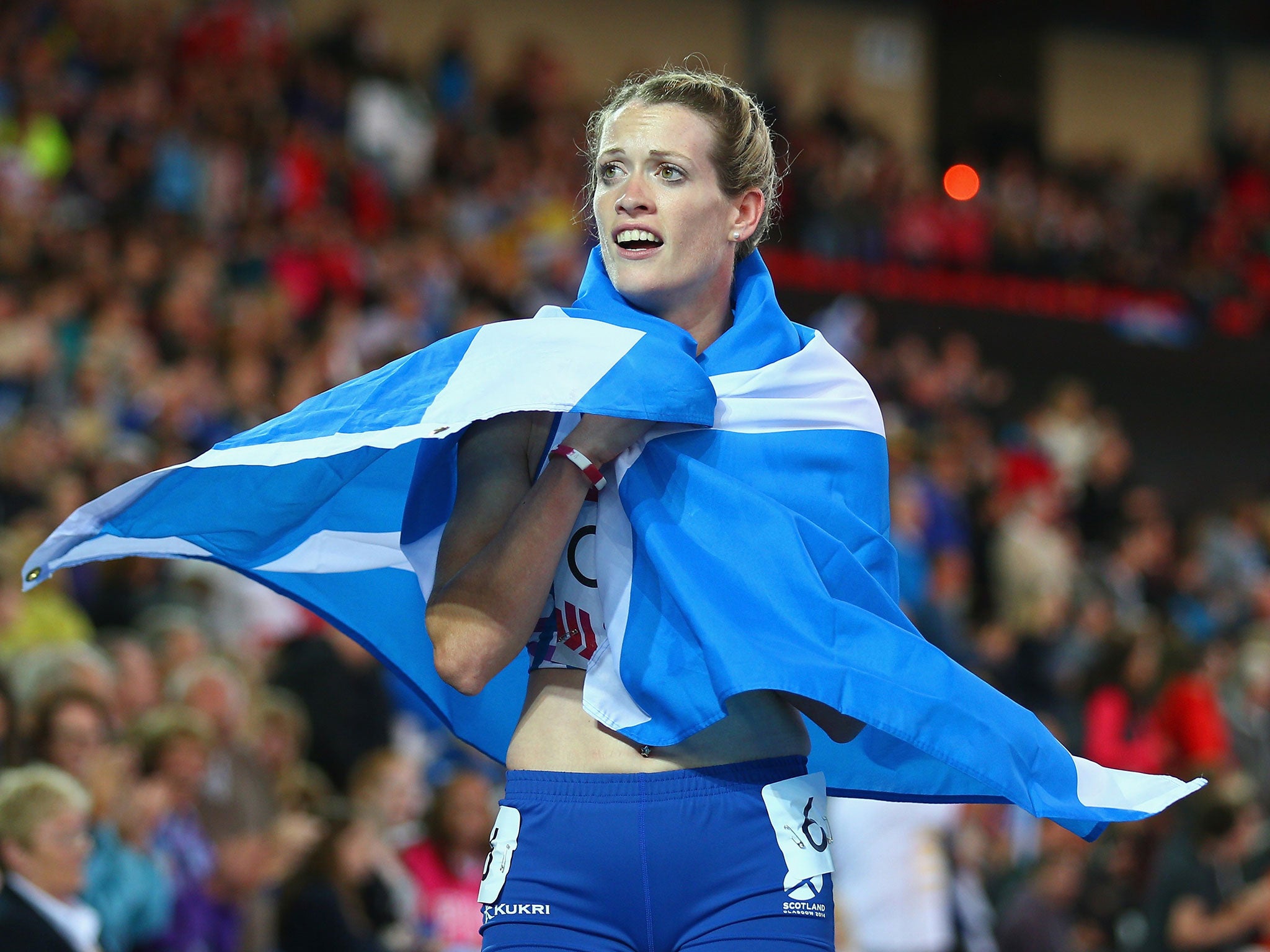 Eilidh Child embarks on a lap of honour after coming second in the 400m hurdles