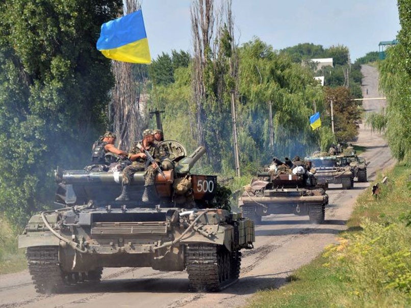 Ukrainian troops patrol near the village of Novoselovka, 30km from the eastern Ukrainian city of Donetsk