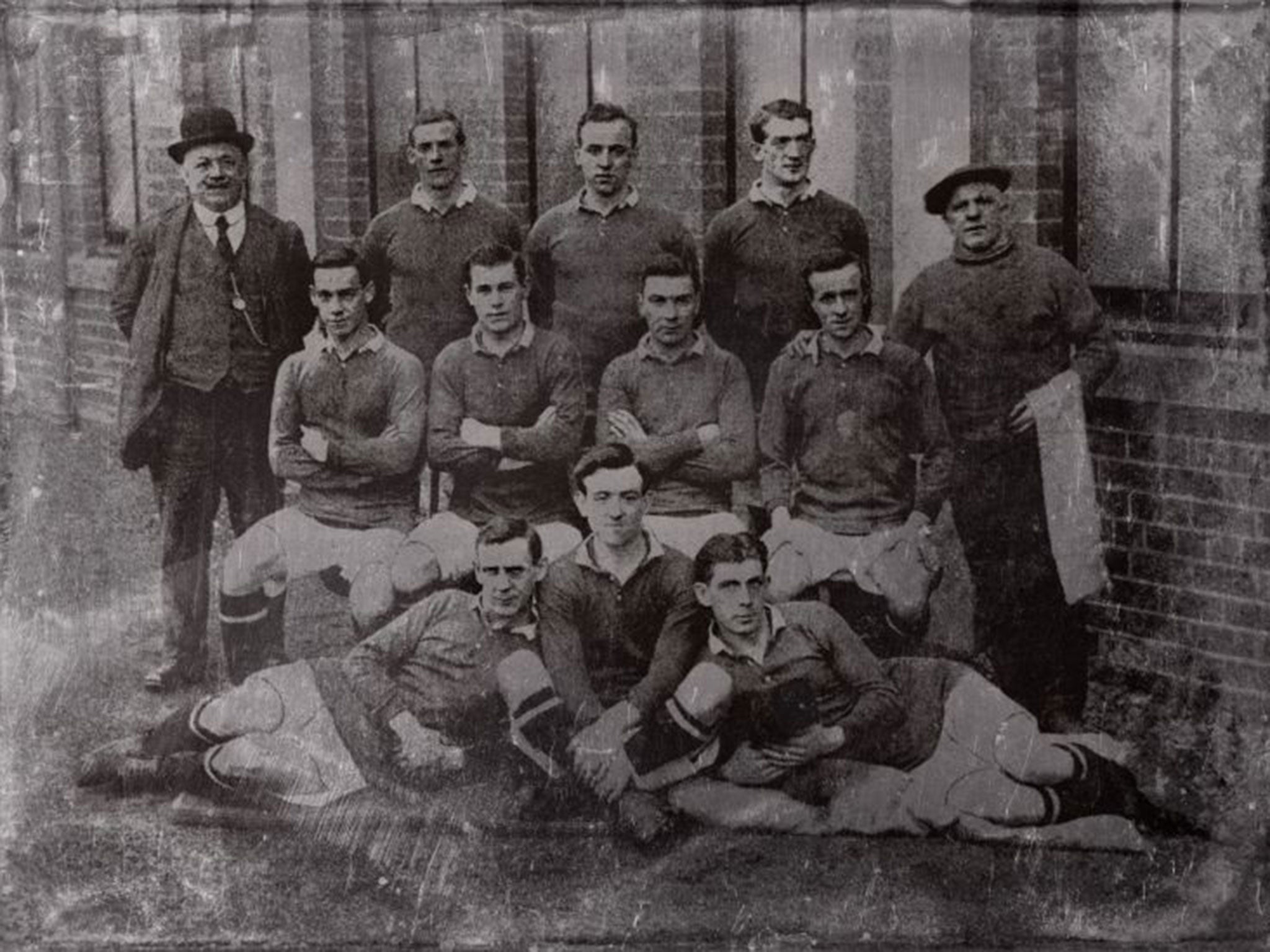 The players posing in their football kit the day they were enlisted