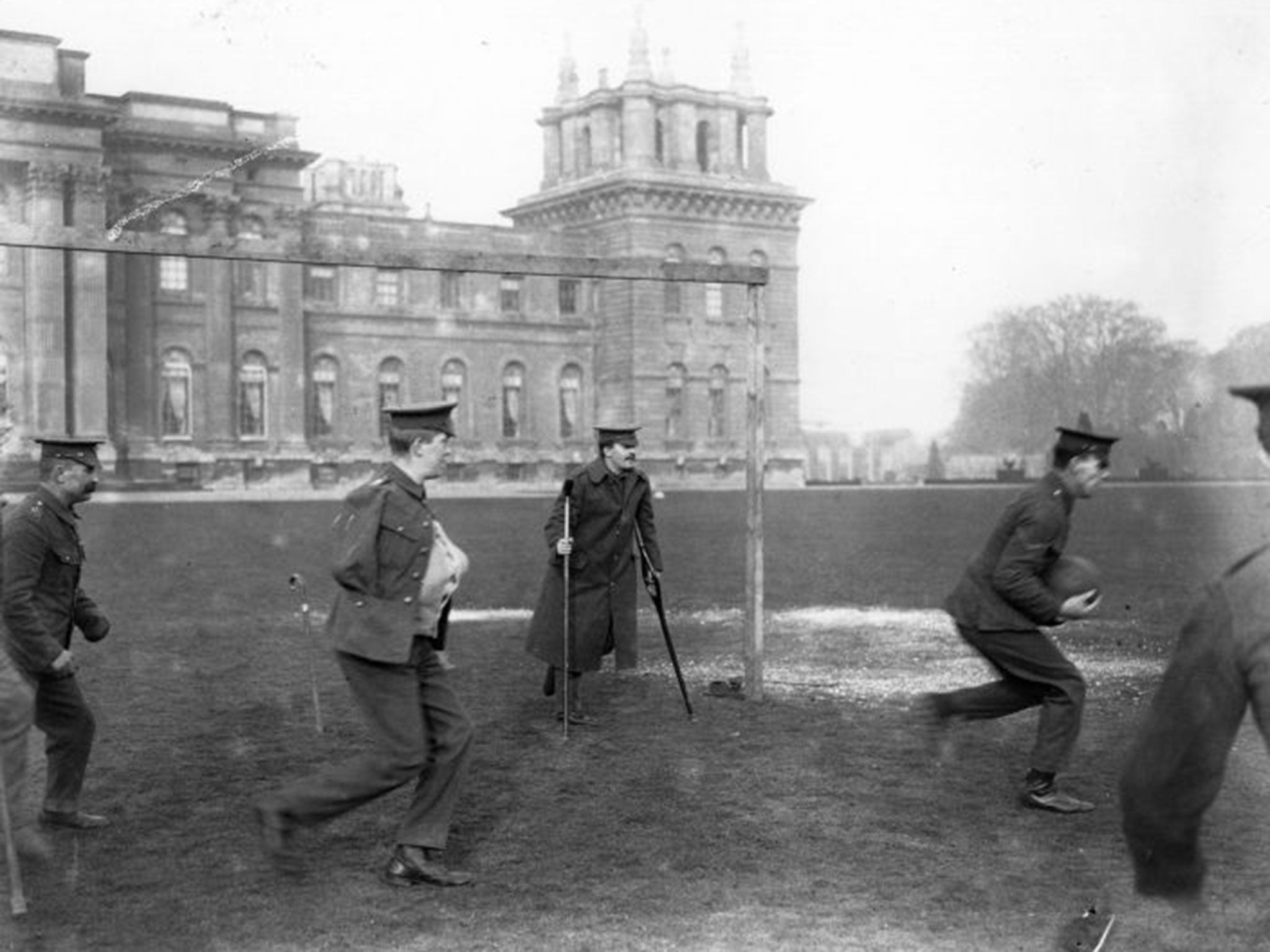 Wounded soldiers play football outside Blenheim Palace during the Great War