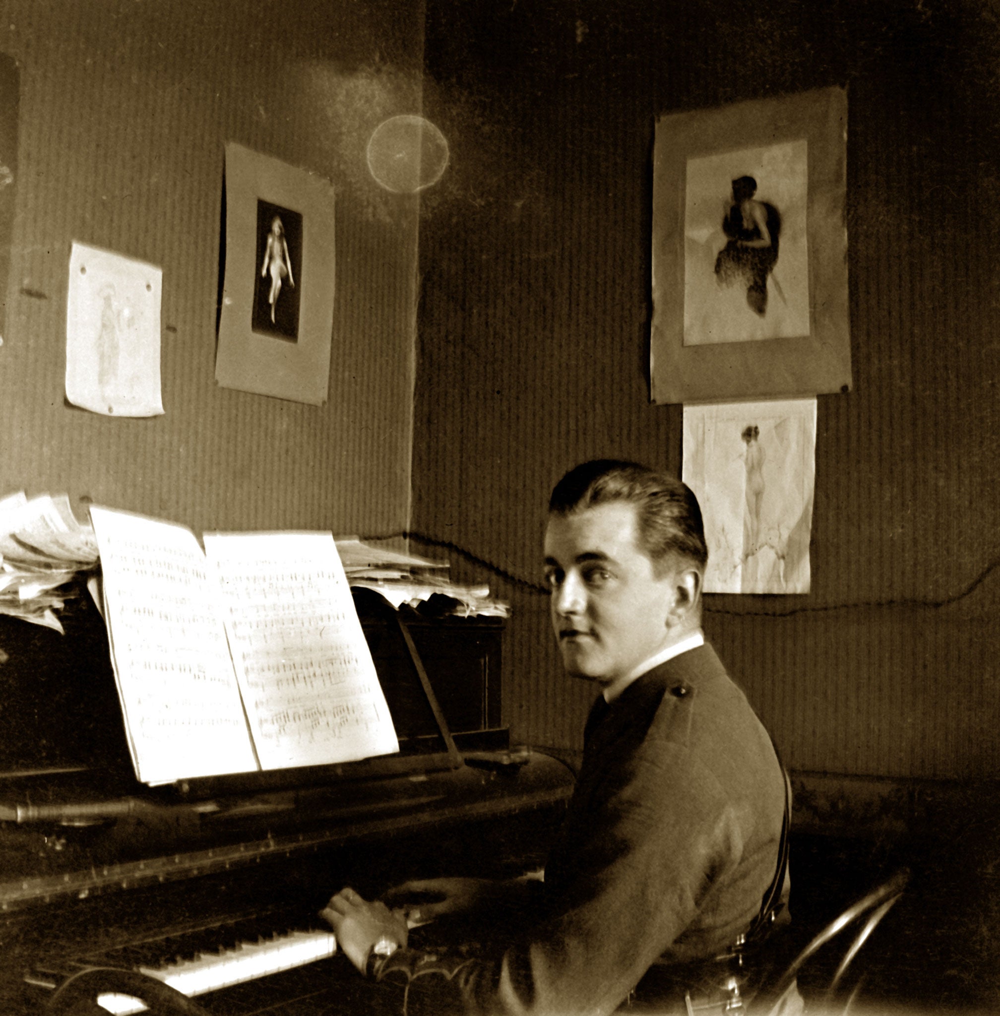 An officer plays the piano in a brothel