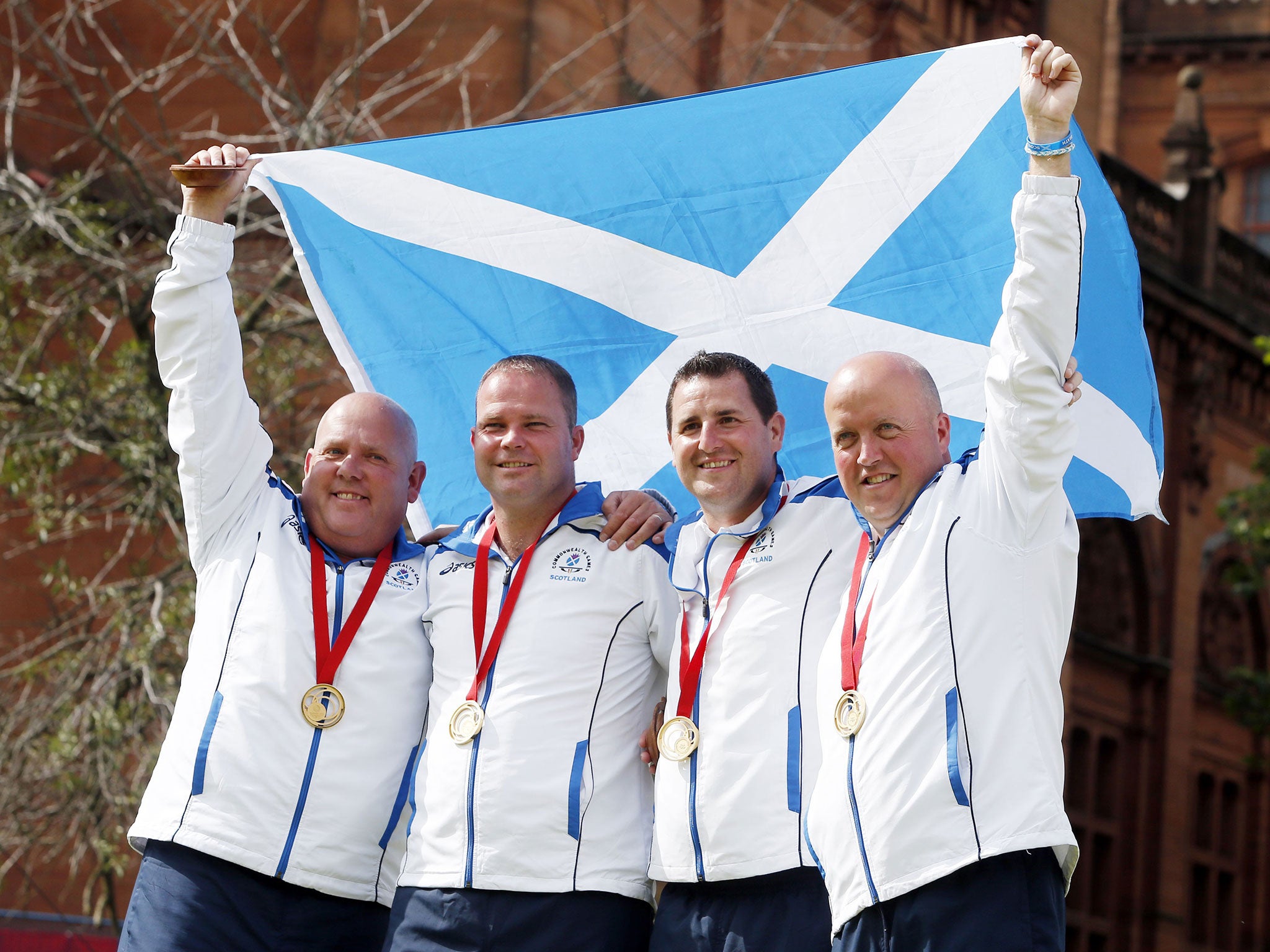 Men’s fours champions (left to right) Alex Marshall, Paul Foster, Neil Speirs and David Peacock celebrate
winning gold yesterday