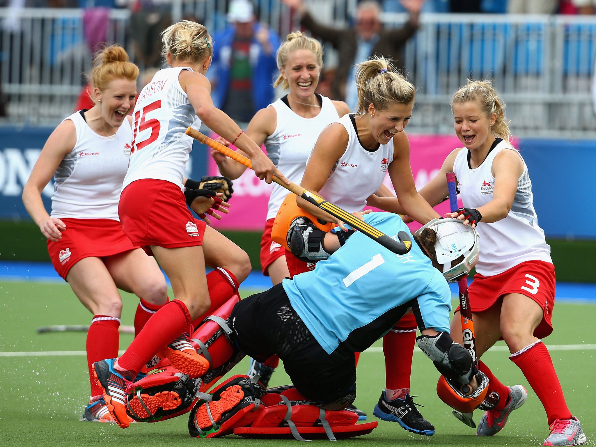 England goalkeeper Maddie Hinch is mobbed after her shoot-out heroics