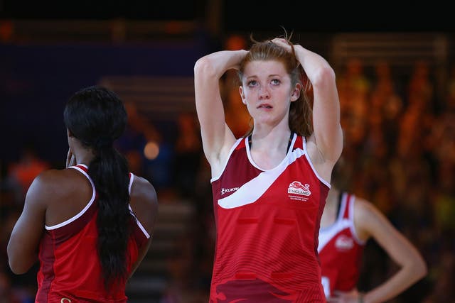 Helen Housby of England is dejected after New Zealand defeated England in the netball semi final