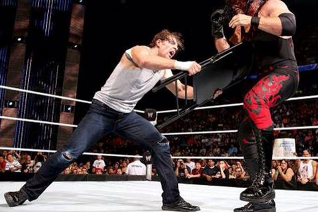 Dean Ambrose levels the playing field with a chair in his handicap match against Kane and Seth Rollins
