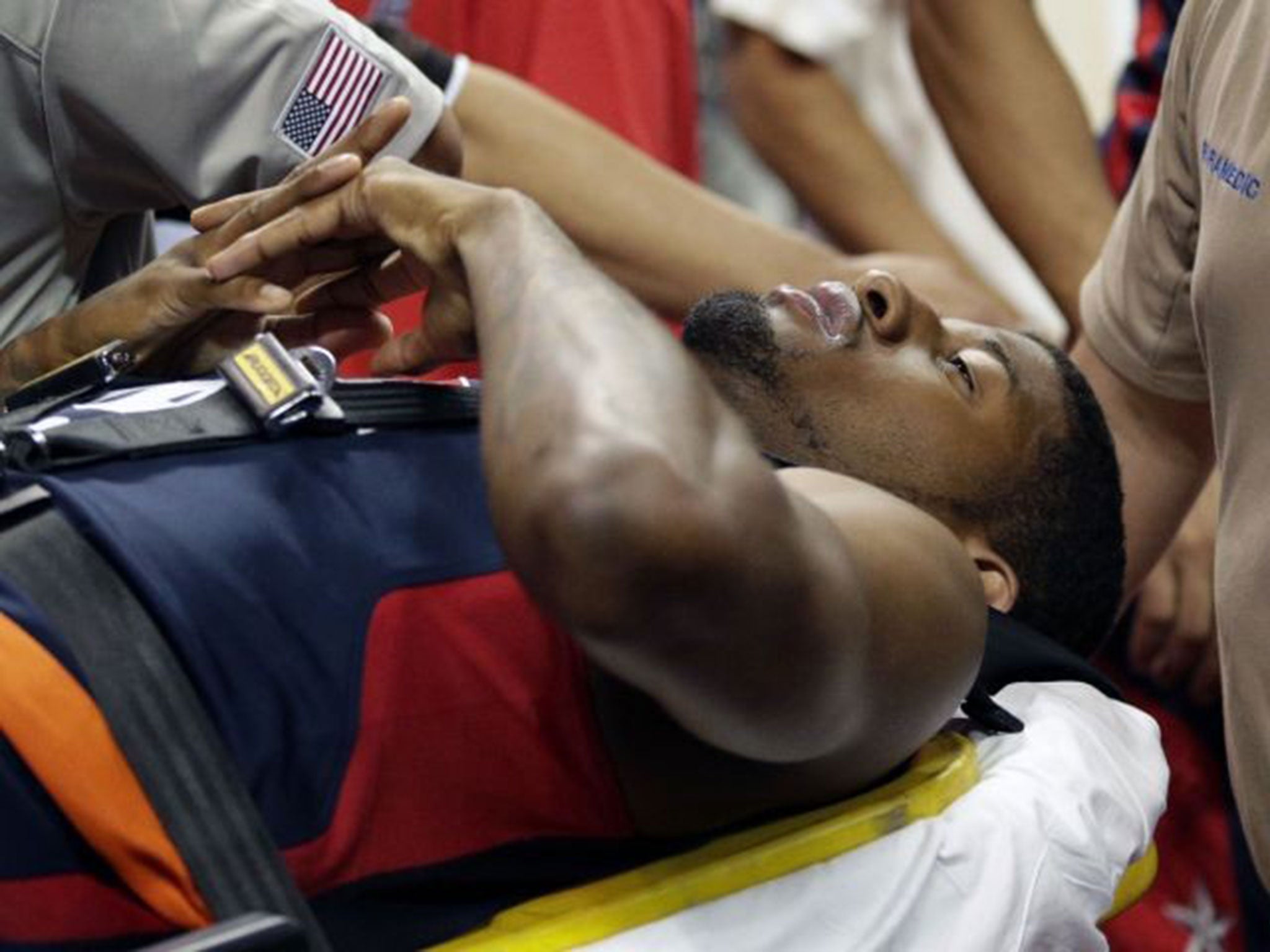Paul George is carried off the court after suffering a broken leg