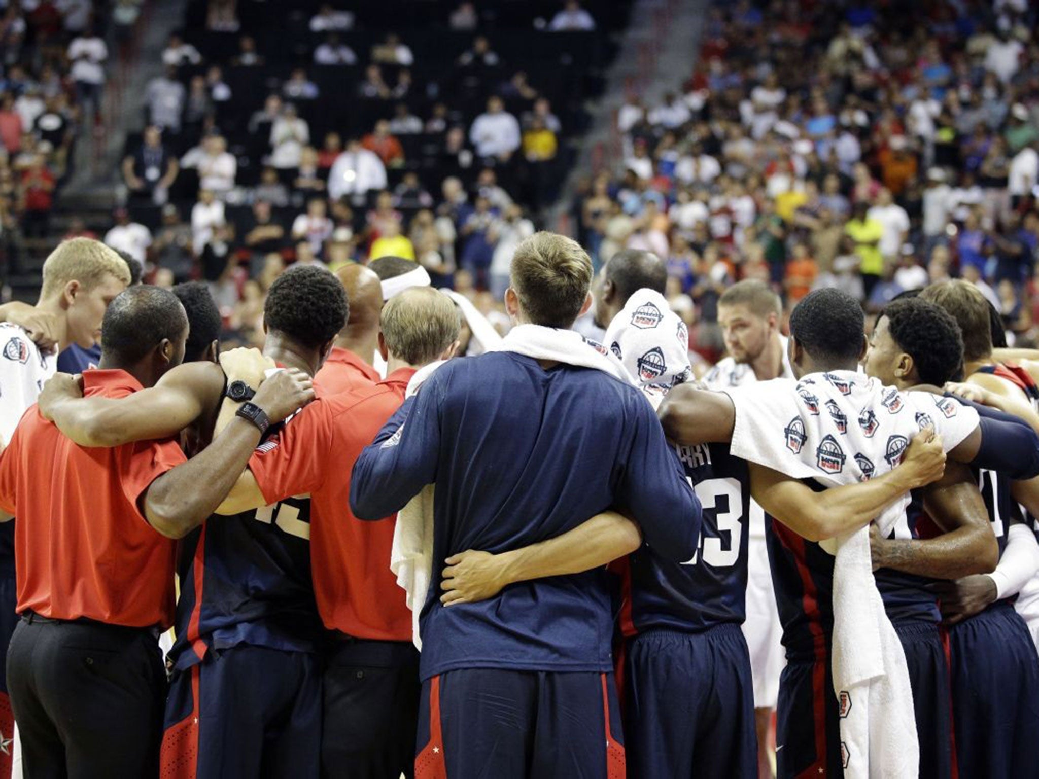 Team USA huddle together after the shock of seeing George's injury