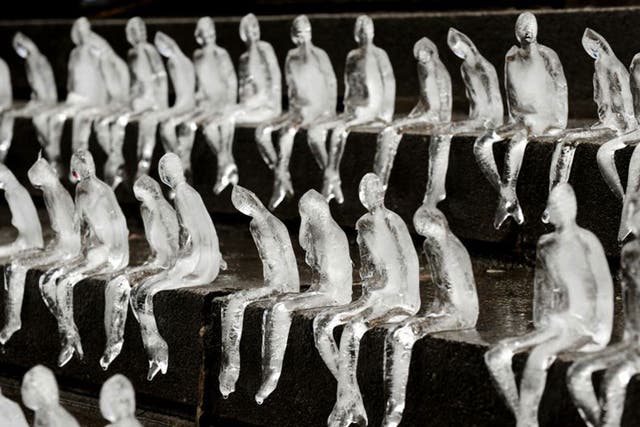 In Birmingham yesterday, 5,000 ice figures were left to melt in the sun, a memorial to those who died. The Brazilian artist Nele Azevedo created the sculptures