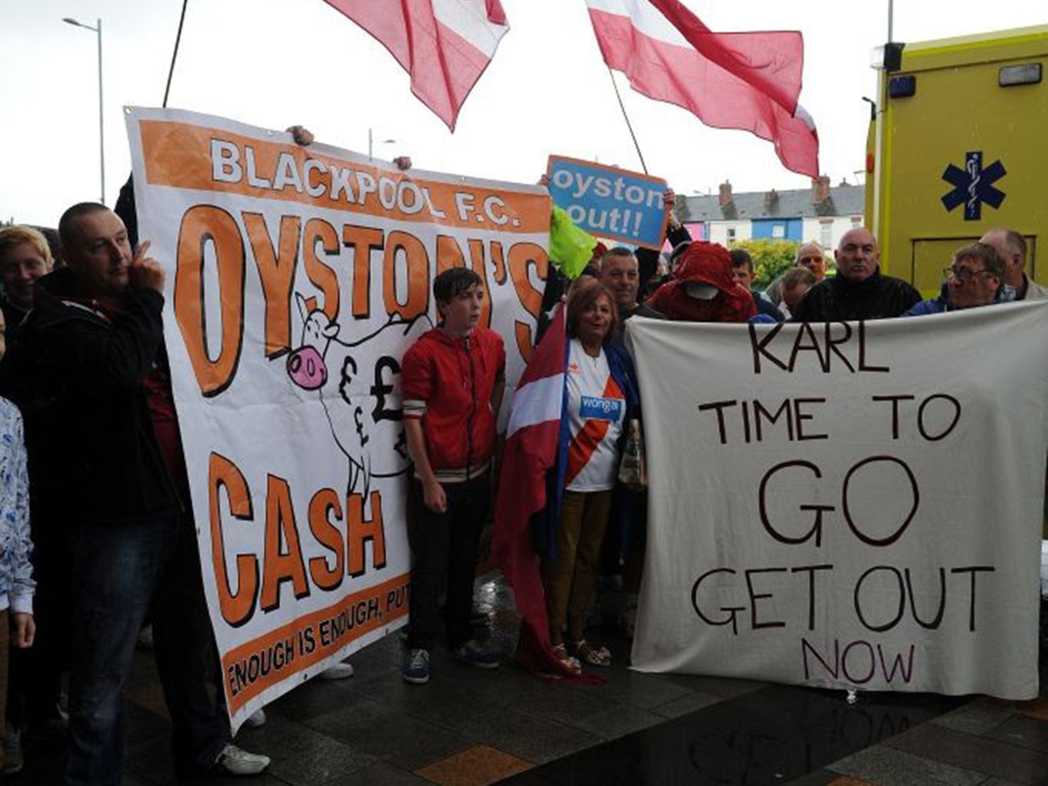 Tangerine nightmare: Fans protest outside Bloomfield Road yesterday