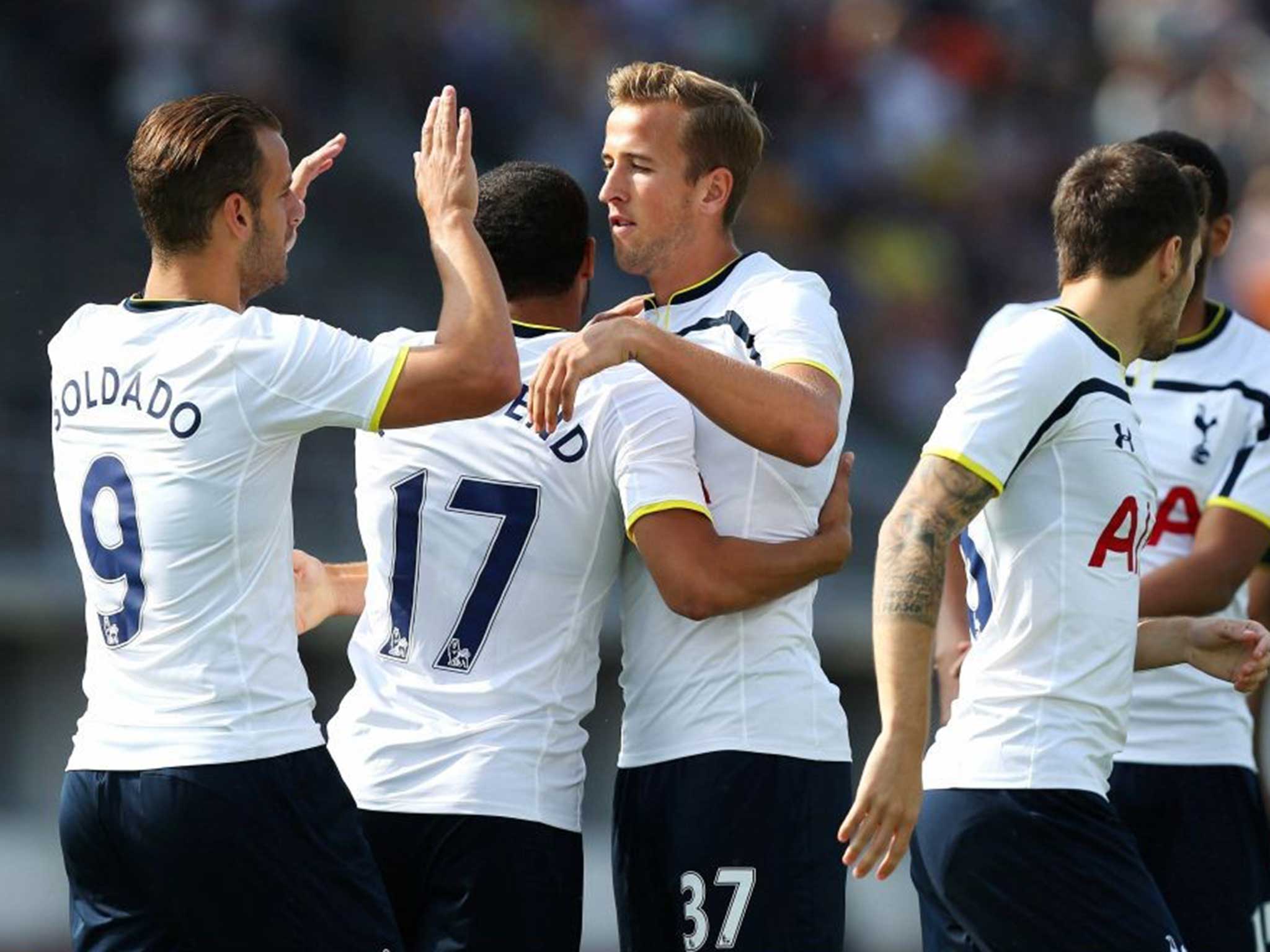 Harry Kane celebrates scoring the first goal for Tottenham with Roberto Soldado and team mates