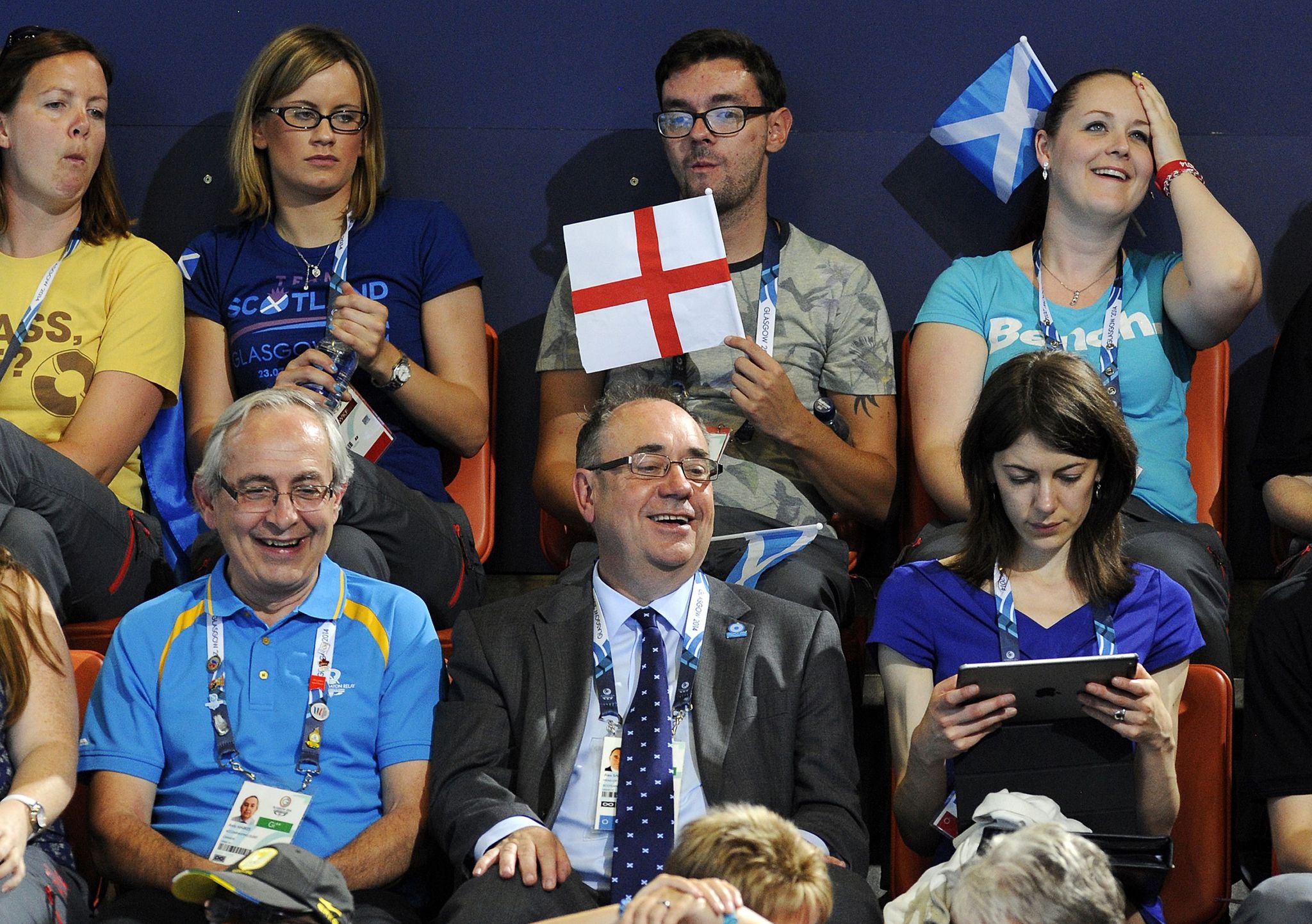 A diving spectator waves the St George flag above Scotland's First Minister Alex Salmond
