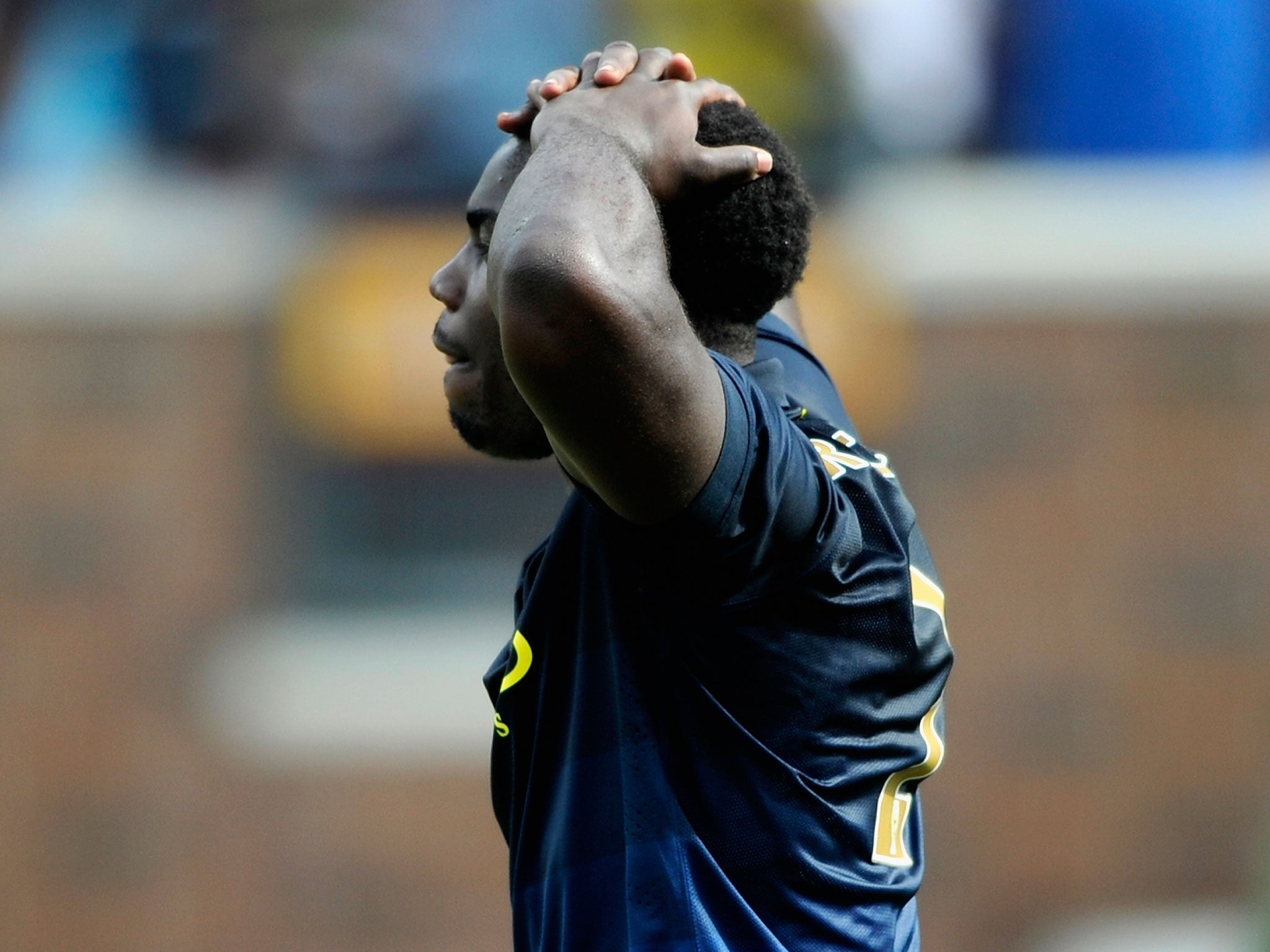 Micah Richards holds his head in shame after blazing his penalty over the bar