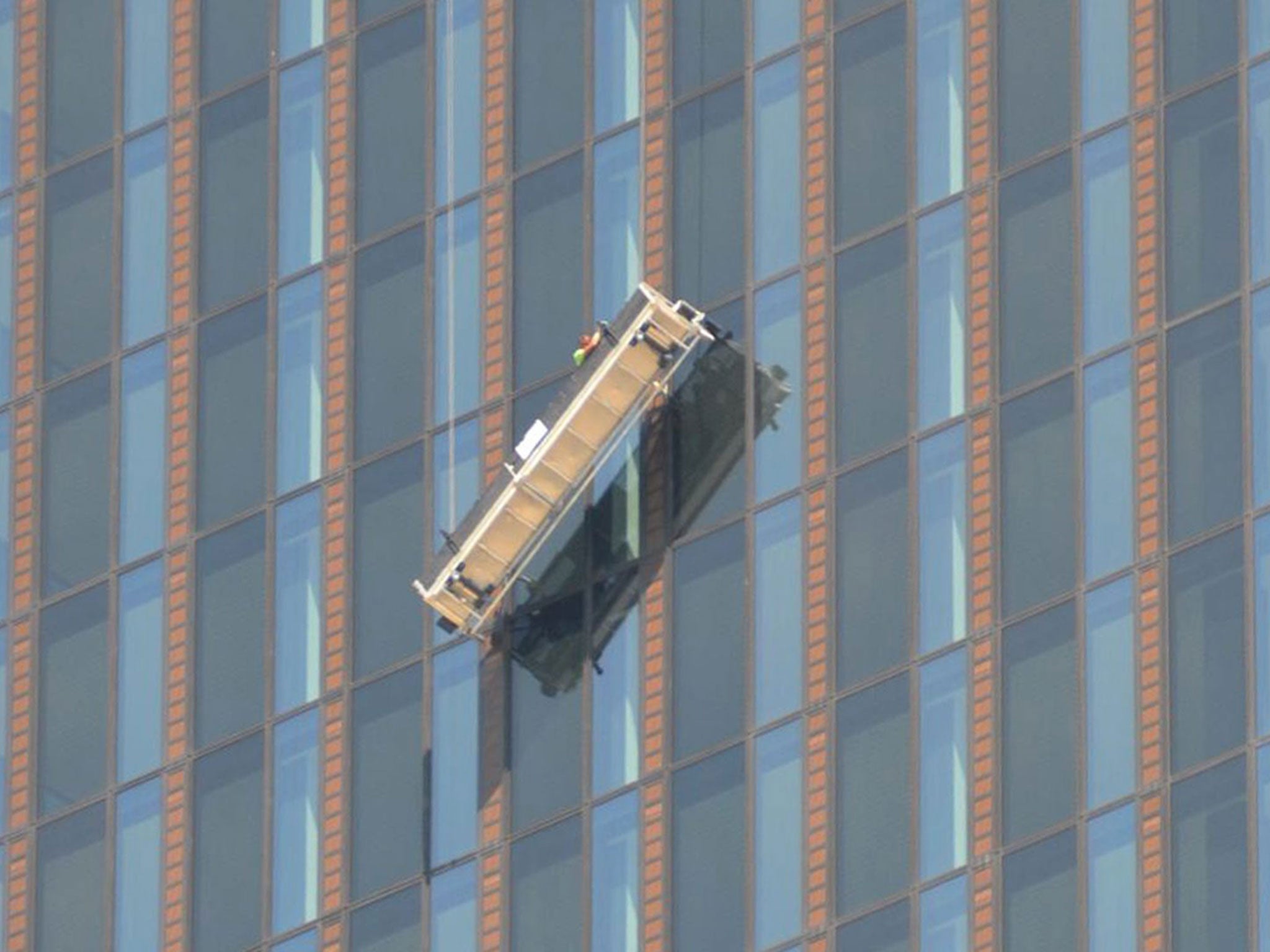 Two window cleaners were trapped 144 metres up from the ground on the 48th floor in front of the 'DC-Tower,' Austria's highest skyscraper