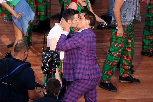 John Barrowman kisses his male “bride” at a mock Gretna Green during the Commonwealth Games opening ceremony 