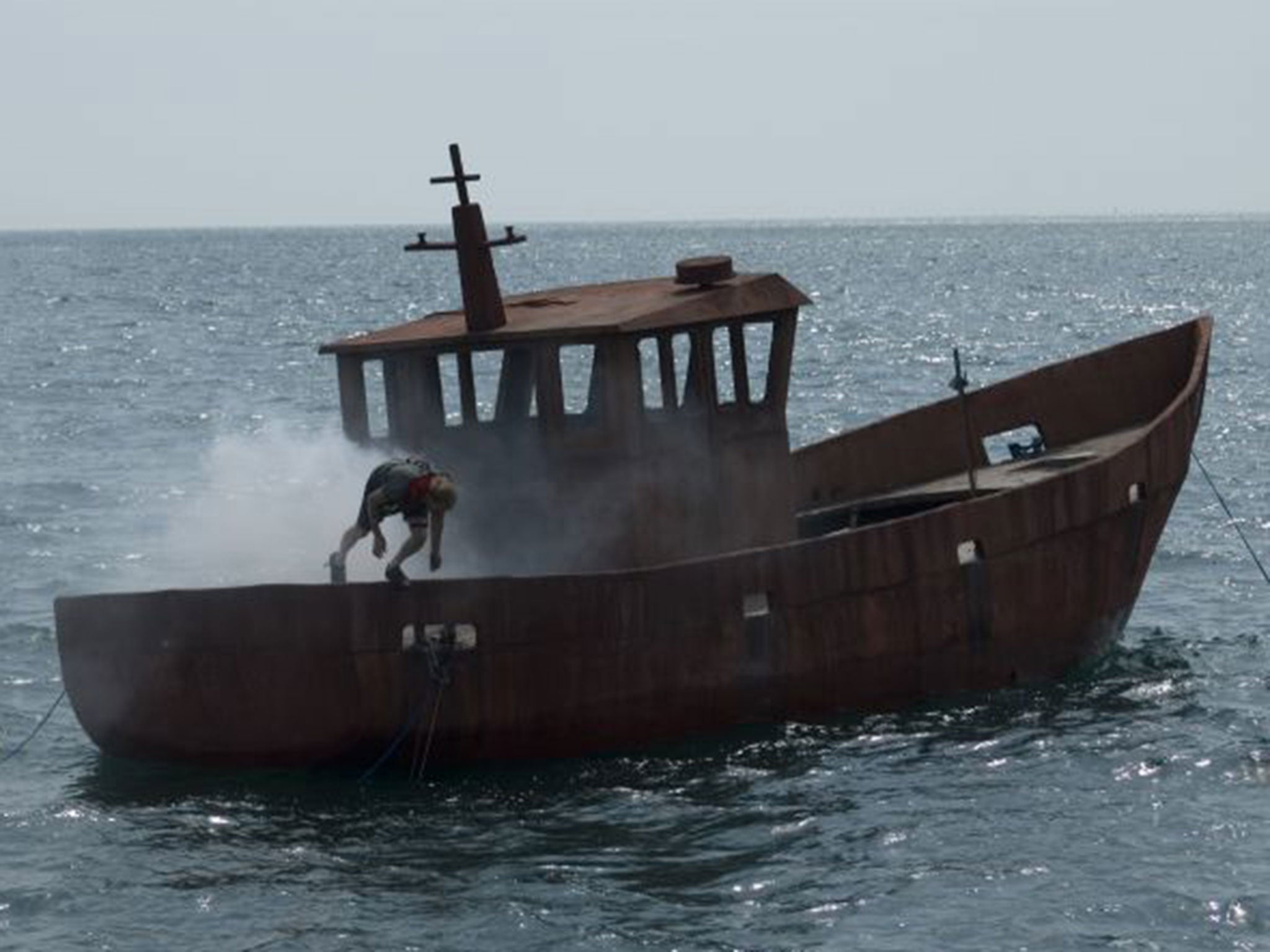 Artist Simon Faithfull sets fire to and sinks boat off Dorset for coral reef project The Independent The Independent pic