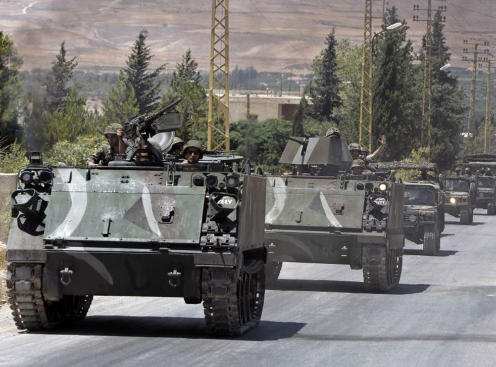 Lebanese army reinforcements arrive in the outskirts of Arsal, a predominantly Sunni Muslim town near the Syrian border in eastern Lebanon, which was overrun by militants