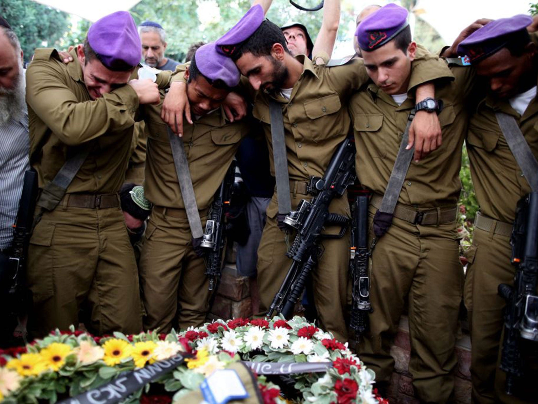 Fellow soldiers were among the 10,000 people who attended the funeral of Lt Hadar Goldin
