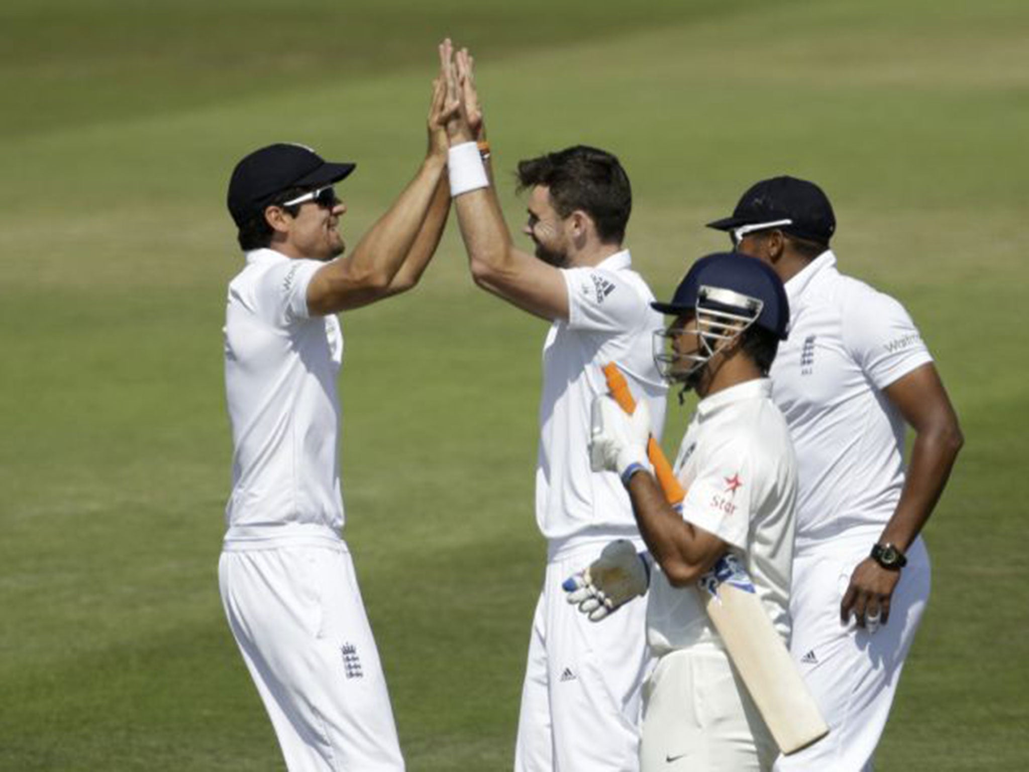 M S Dhoni heads for the pavilion at Southampton after losing his wicket to Jimmy Anderson, second left, at Southampton