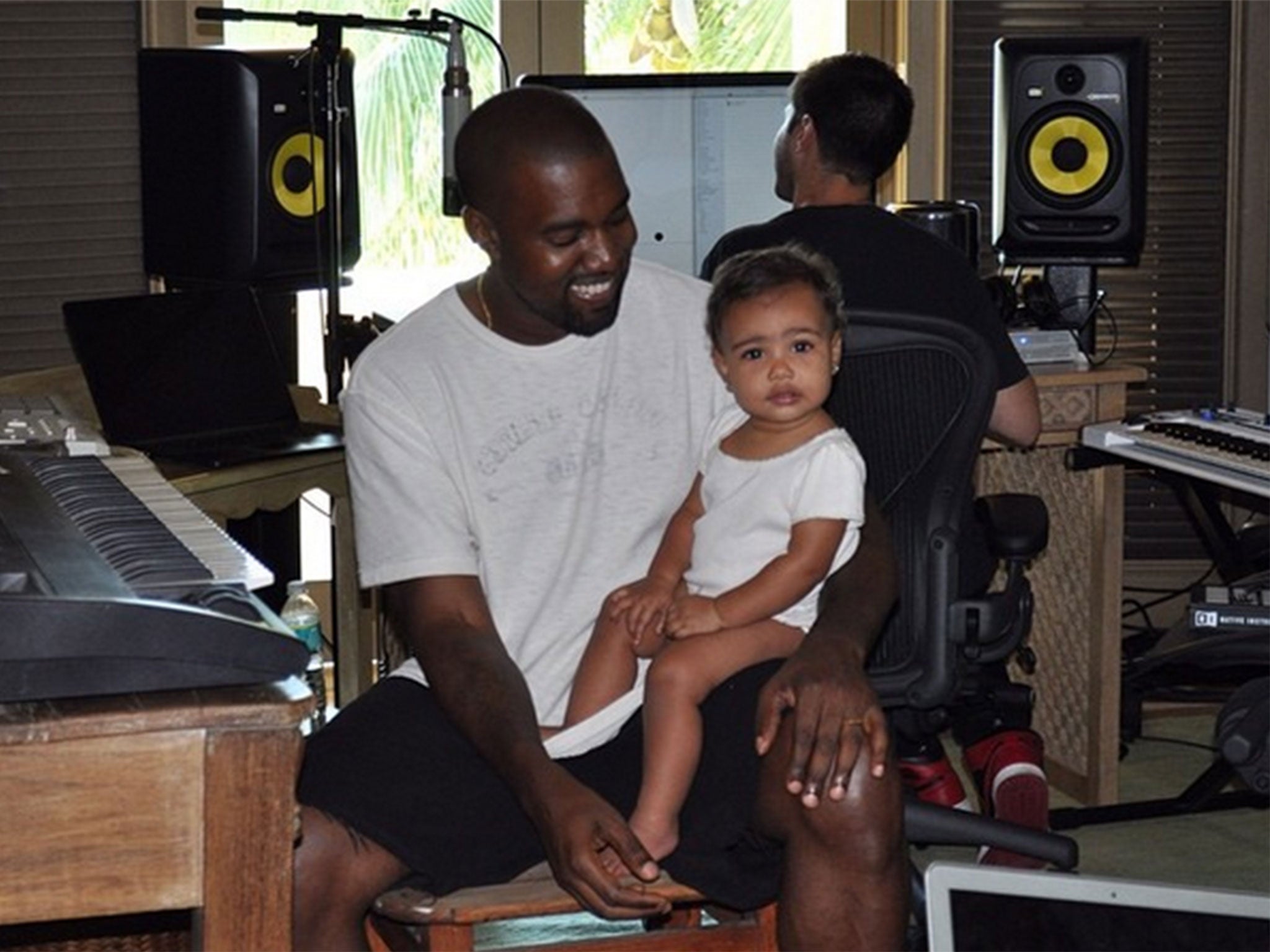 Kanye West and his daughter North in the studio